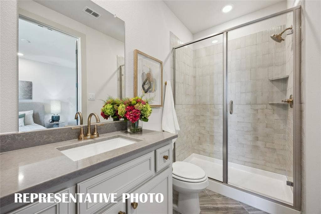 Your guests will never want to leave the beautiful and spacious guest baths in our Sophie plan!  REPRESENTATIVE PHOTO