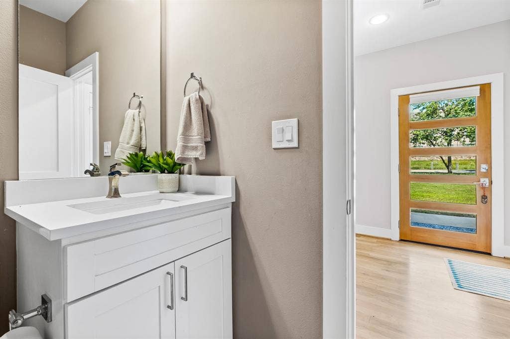 406 Parkview Avenue, Dallas, TX 75223 Bathroom with wood-type flooring and vanity