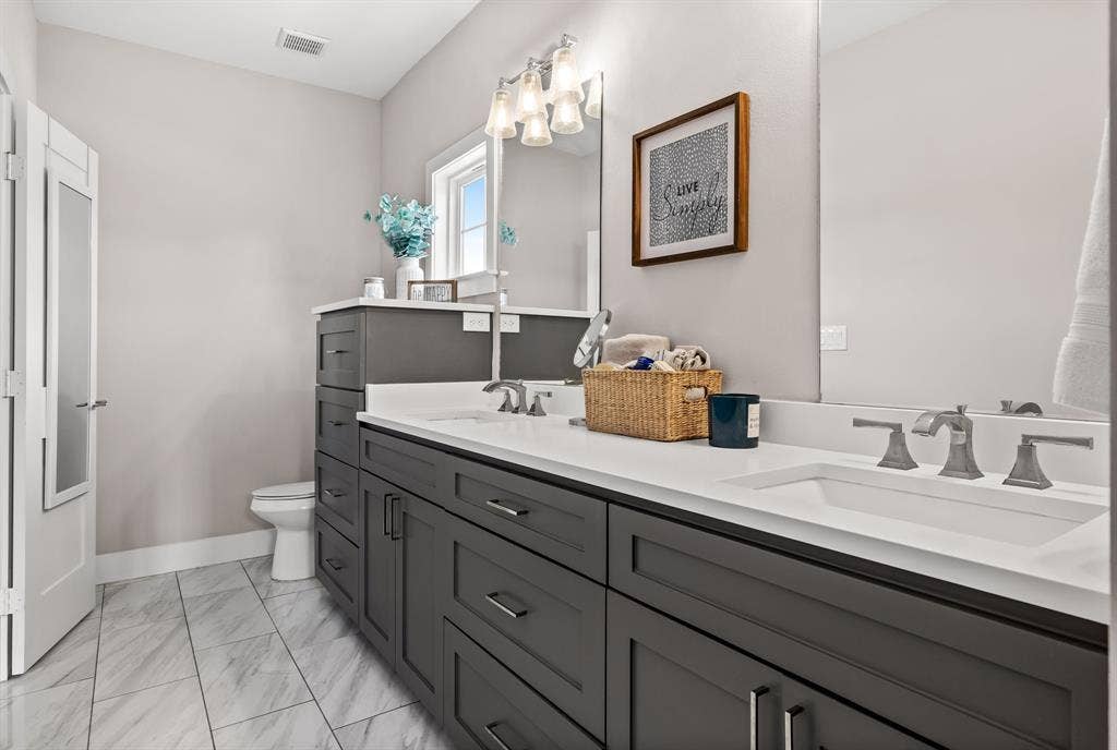 406 Parkview Avenue, Dallas, TX 75223 Bathroom featuring dual vanity, tile flooring, and toilet