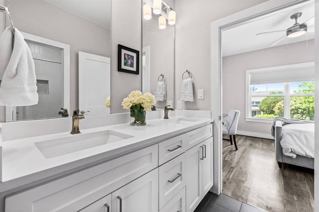 406 Parkview Avenue, Dallas, TX 75223 Bathroom featuring large vanity, double sink, ceiling fan, and hardwood / wood-style floors