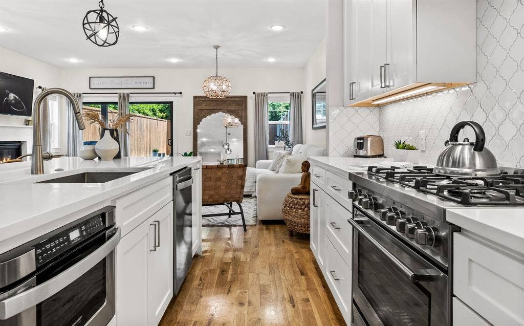 406 Parkview Avenue, Dallas, TX 75223 Island features pull out microwave drawer dishwasher and pull out trash drawer.