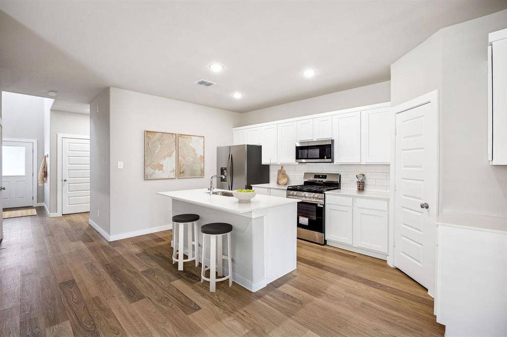 1100 Old Stead Drive, Princeton, TX 75071 Kitchen in the Willow home plan – REPRESENTATIVE PHOTO