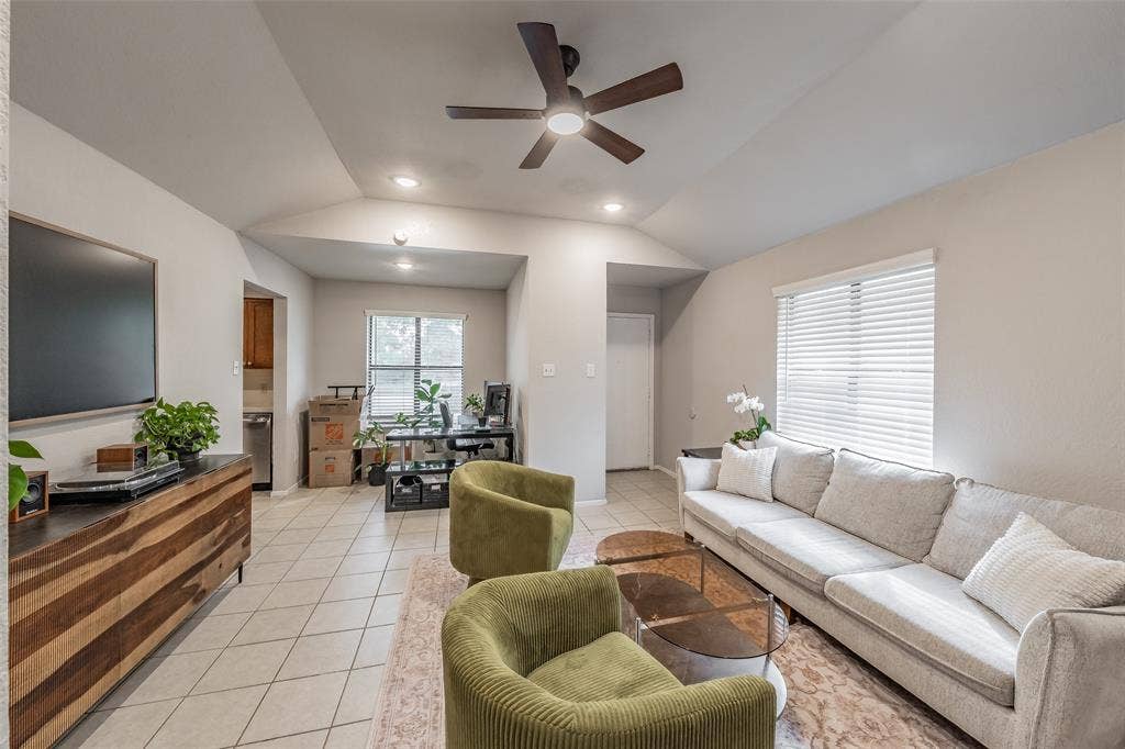 1128 Vaulted ceilings, neutral wall tones, recessed lighting, multi-blade ceiling fan, and ceramic tile flooring