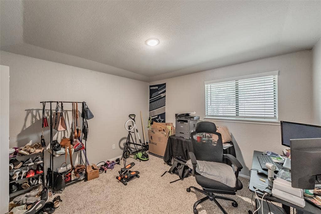 1126 Neutral-toned room featuring a coffered ceiling, recessed lighting, and a window with horizontal blinds