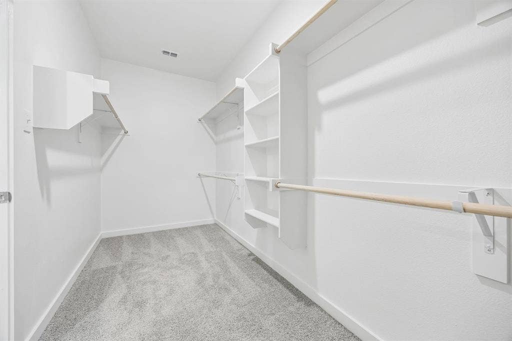 711 Edgehurst Drive, Princeton, TX 75071 Walk-in closet in the Heisman home plan – REPRESENTATIVE PHOTO