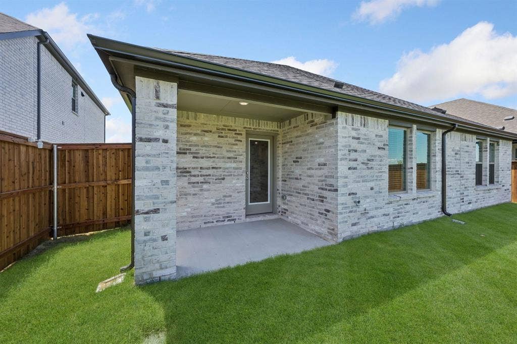 711 Edgehurst Drive, Princeton, TX 75071 Covered patio in the Heisman home plan – REPRESENTATIVE PHOTO