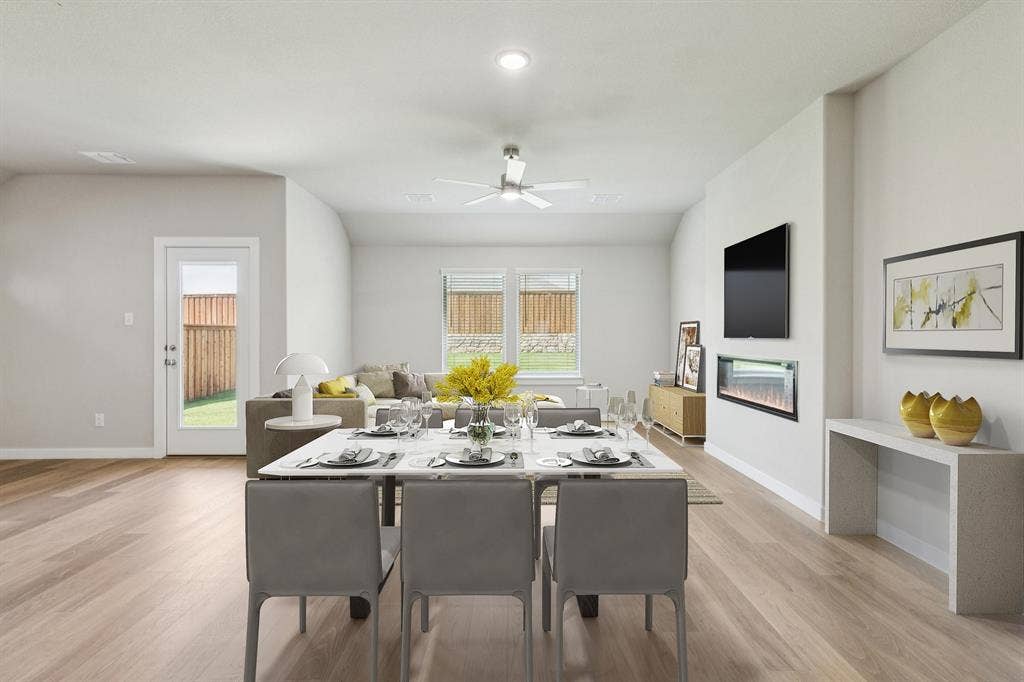 711 Edgehurst Drive, Princeton, TX 75071 Living room in the Heisman home plan – REPRESENTATIVE PHOTO