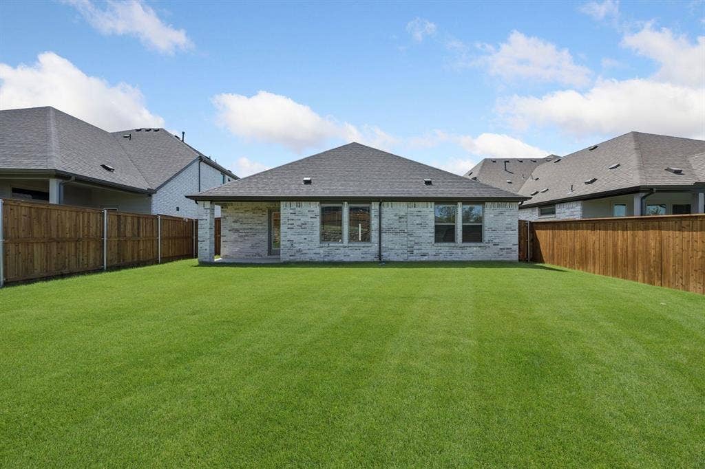711 Edgehurst Drive, Princeton, TX 75071 Covered patio in the Heisman home plan – REPRESENTATIVE PHOTO