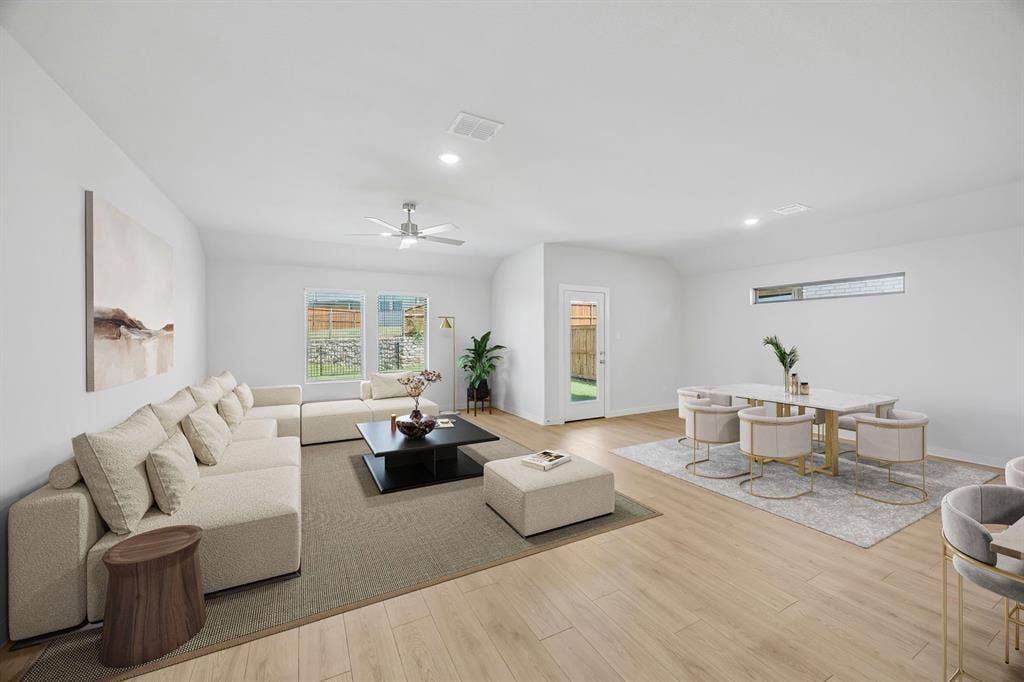 711 Edgehurst Drive, Princeton, TX 75071 Living room in the Heisman home plan – REPRESENTATIVE PHOTO