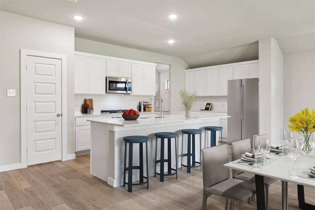 711 Edgehurst Drive, Princeton, TX 75071 Kitchen in the Heisman home plan – REPRESENTATIVE PHOTO