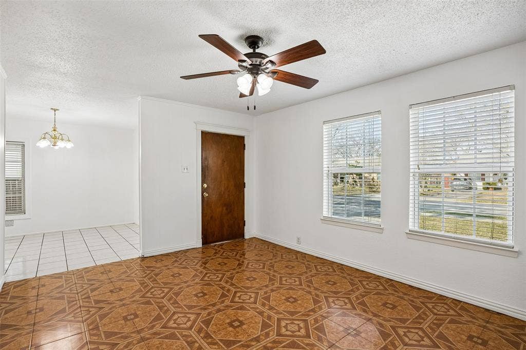 3708 Davila Drive, Dallas, TX 75220 Open living room with views of front yard and open to the dining area.