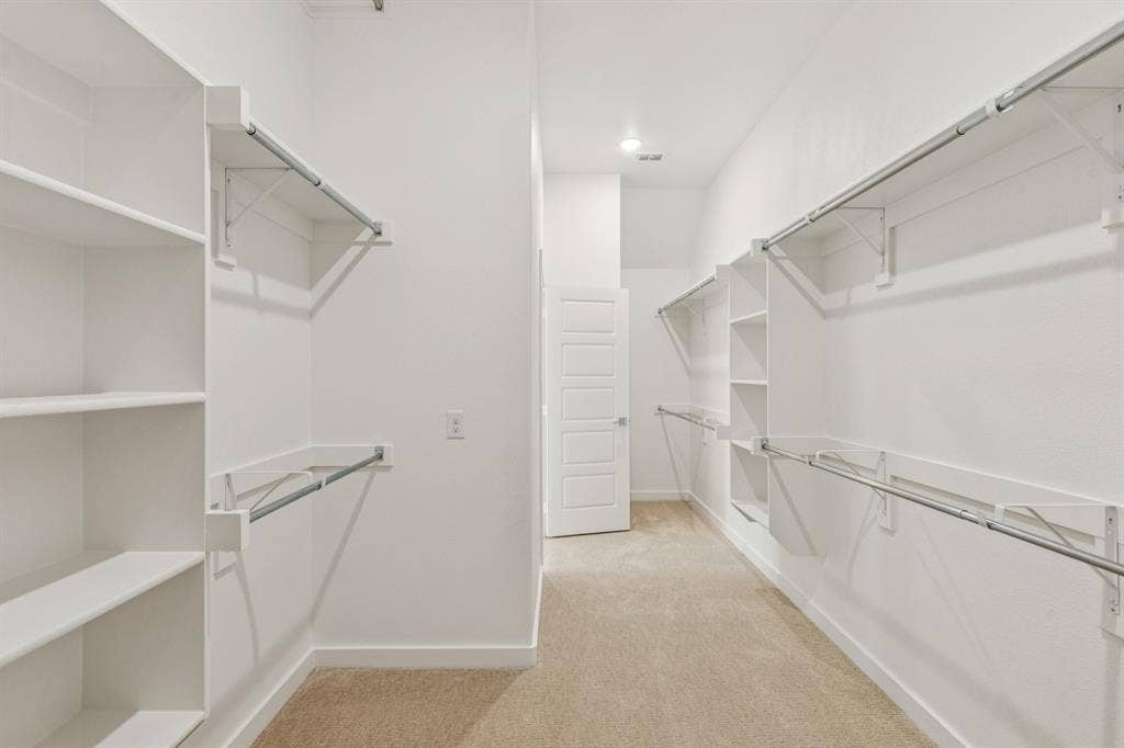 4736 Carina Road, McKinney, TX 75071 Primary Closet in the Da Vinci II home plan – REPRESENTATIVE PHOTO