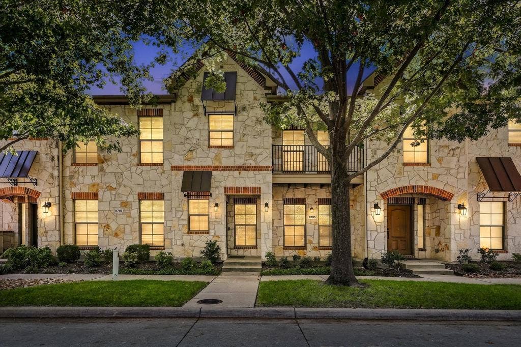 NORTH FACING townhome with a covered front porch and a covered, private balcony too directly across from the pool, fitness center, and clubhouse.