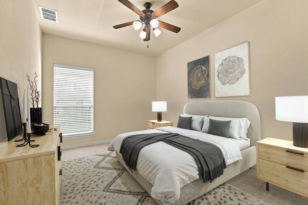 A charming secondary bedroom with room to relax, recharge, and feel right at home. Virtual Staging.