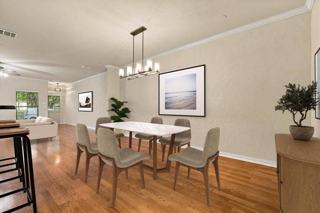 Imagine dinner parties and holiday gatherings in this spacious dining area with new chandelier and room for a large table. Virtual Staging.