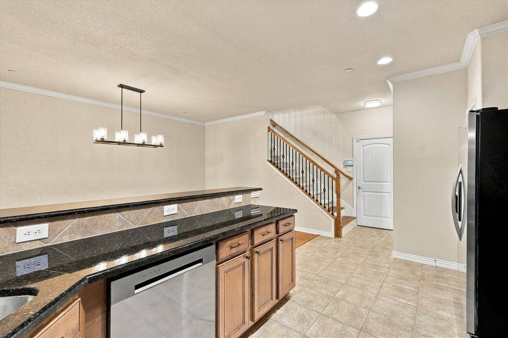 A NEW dishwasher and a stunning granite serving bar make meal prep and cleanup a breeze!