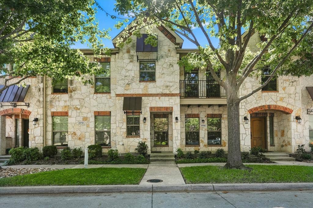 Beautiful stone architecture, energy efficient, peaceful surroundings, and a charming covered balcony nestled among mature trees!