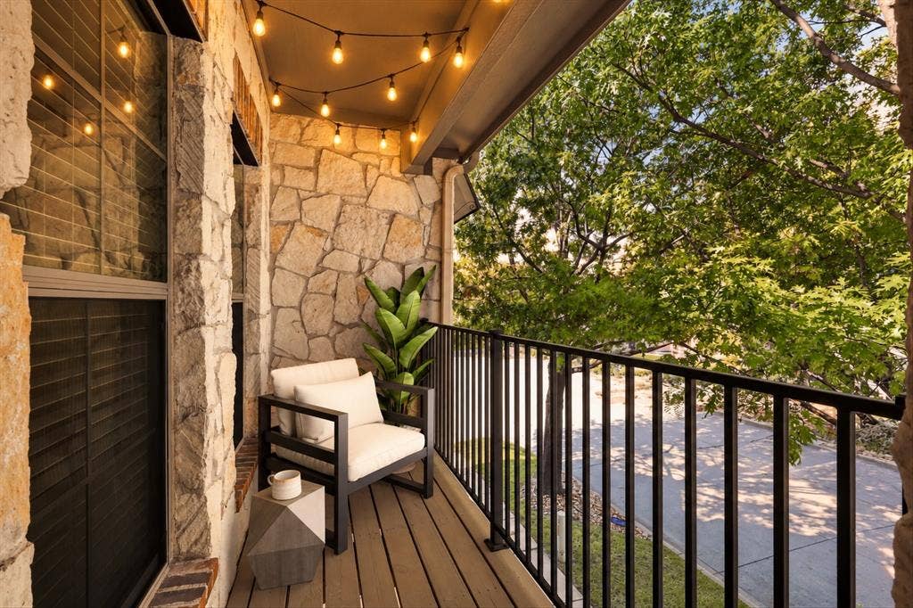 Step outside your primary suite and unwind on your own charming, tree-lined balcony. Virtual Staging.