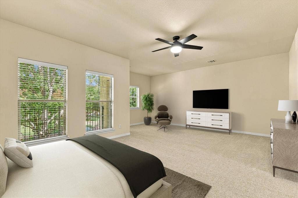 Wake up to beautiful treetop views in your oversized primary suite with plenty of room for additional seating and direct access to your covered balcony. Virtual Staging.