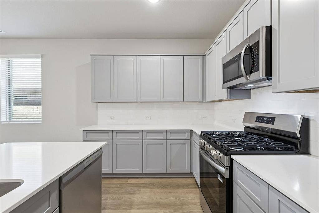 2303 Warm Glow Way, Princeton, TX 75407 Kitchen in the Haylee home plan - REPRESENTATIVE PHOTO