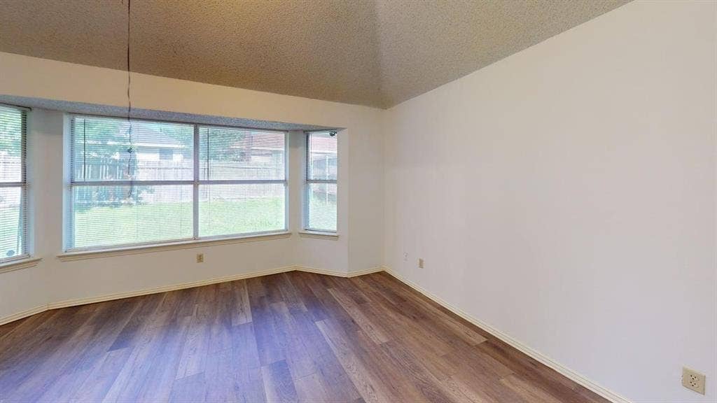 733 Rockett Lane, Cedar Hill, TX 75104 Vaulted ceiling, wood-finish flooring, and a large bay window configuration