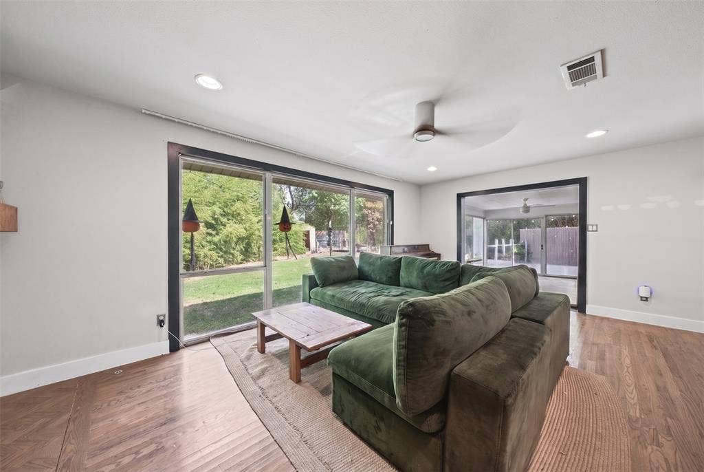 605 Ranier Circle, Garland, TX 75041 Living area featuring wood-finish flooring, recessed lighting, ceiling fan, and sliding glass doors