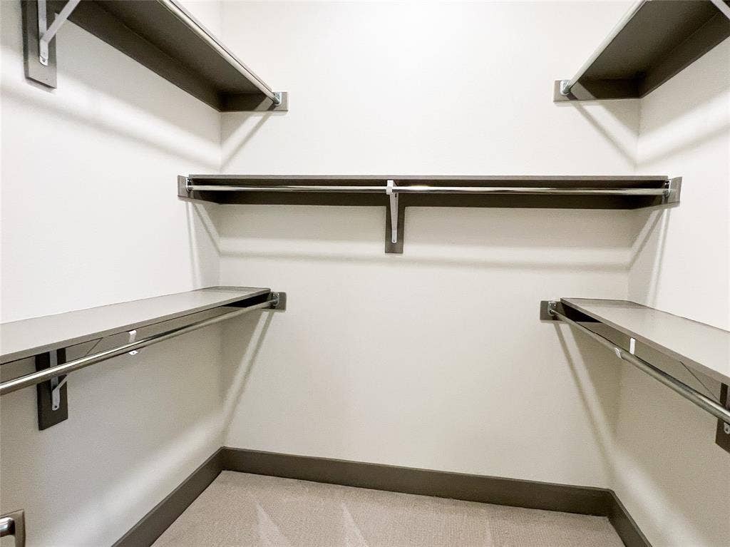 4020 McEwen Road, #4103, Farmers Branch, TX 75244 Walk in closet with light colored carpet