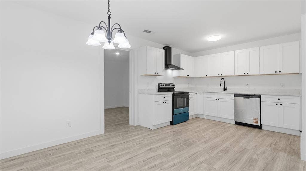 4330 Scottsdale Drive, Mesquite, TX 75150 Kitchen featuring white shaker-style cabinetry, wood-finish flooring, a stainless steel dishwasher, a black range hood, and a five-light chandelier