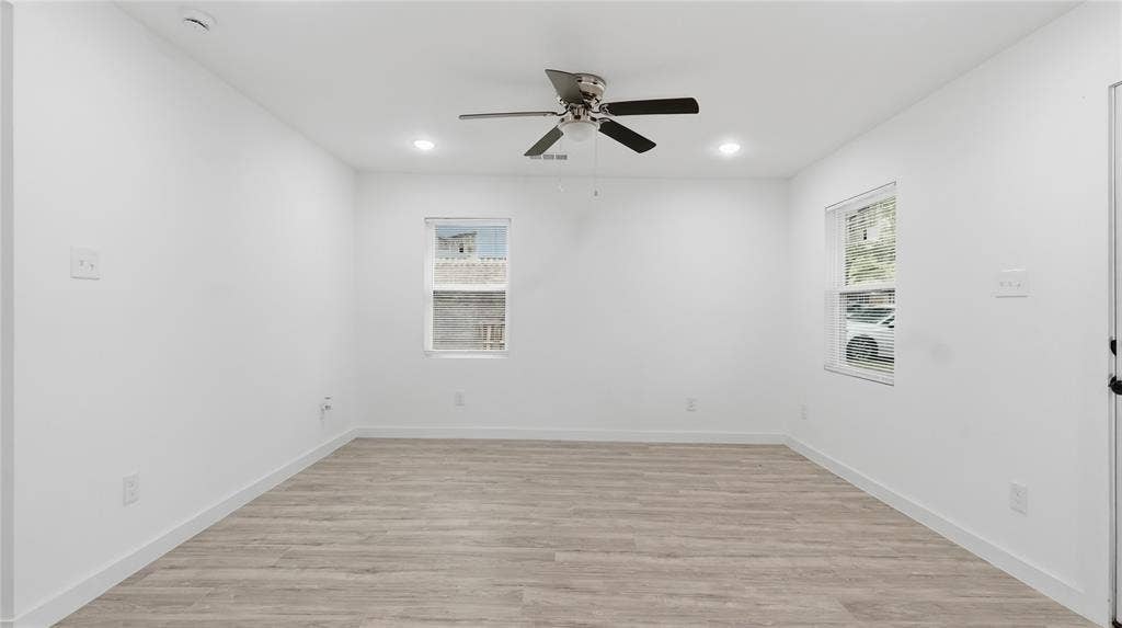 4330 Scottsdale Drive, Mesquite, TX 75150 Neutral-toned interior featuring wood-finish flooring, recessed lighting, and a ceiling fan