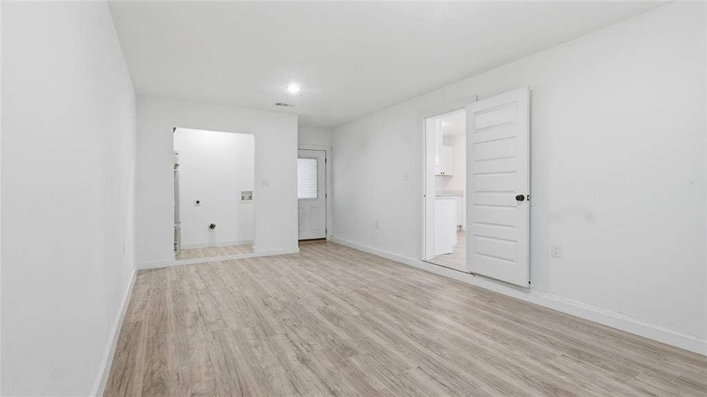 4330 Scottsdale Drive, Mesquite, TX 75150 Neutral interior featuring wood-finish flooring, a multi-panel door, and recessed lighting