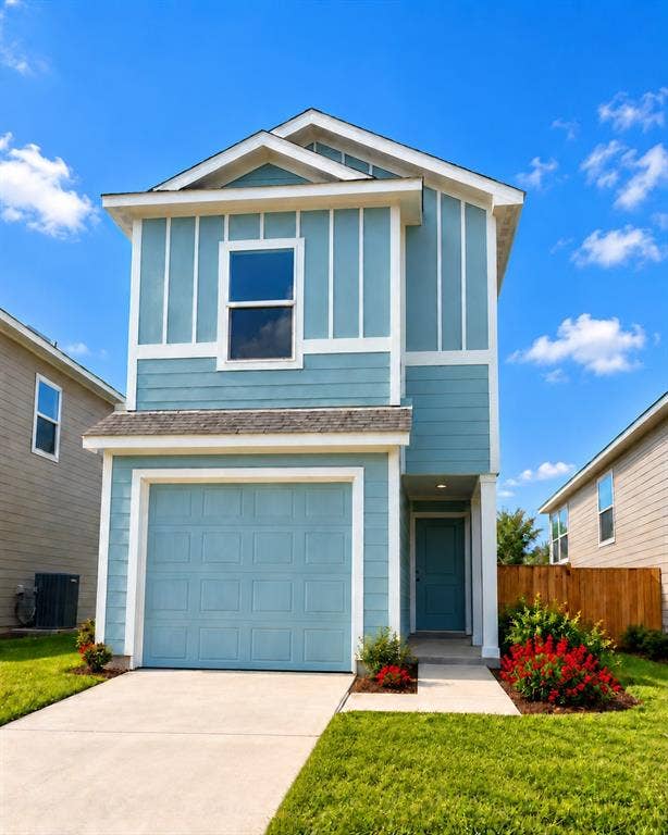 Two-story exterior featuring board-and-batten and lap siding, a single-car garage, and a concrete driveway