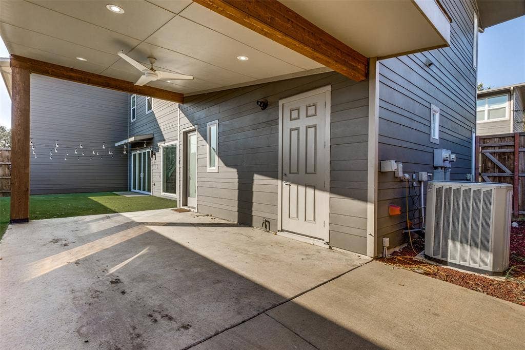 Covered concrete patio featuring recessed lighting, a ceiling fan, exposed wood beams, and siding exterior