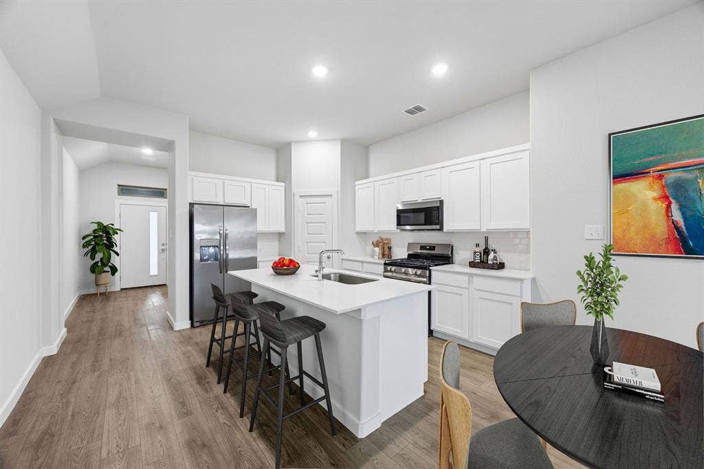 1111 Bridgewalk Drive, Princeton, TX 75071 Kitchen in the Cedar home plan – REPRESENTATIVE PHOTO