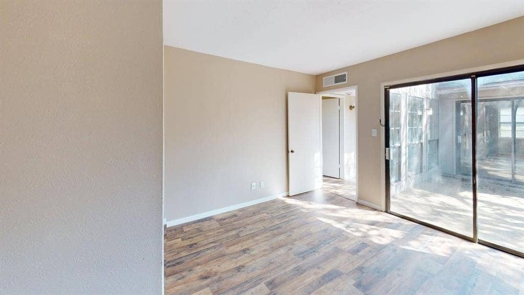 510 Matterhorn Street, Cedar Hill, TX 75104 Neutral wall color, wood-finish flooring, and large sliding glass doors