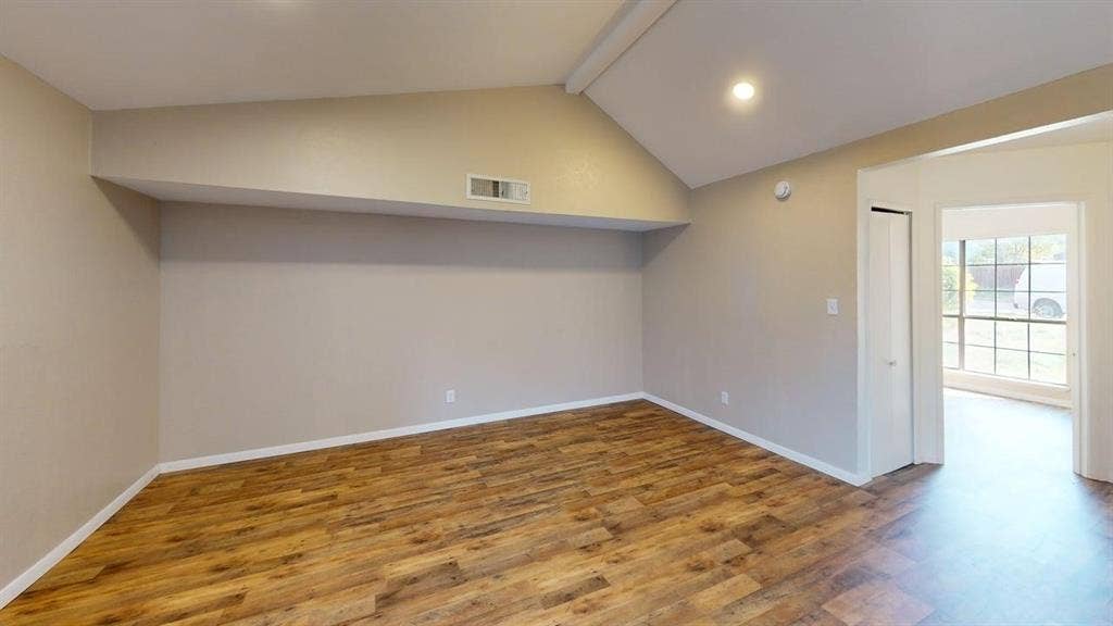510 Matterhorn Street, Cedar Hill, TX 75104 Vaulted ceiling featuring recessed lighting, wood-finish flooring, and a closet with a bi-fold door