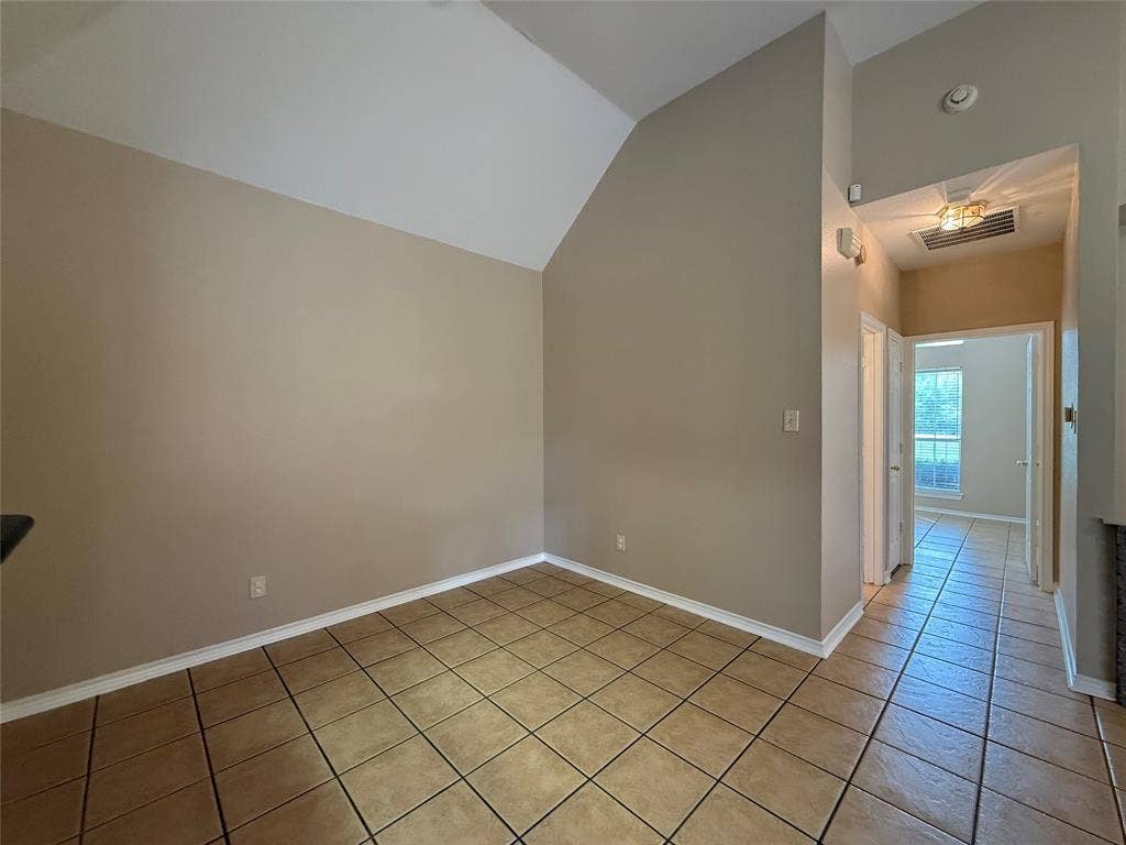 Vaulted ceiling and ceramic tile flooring
