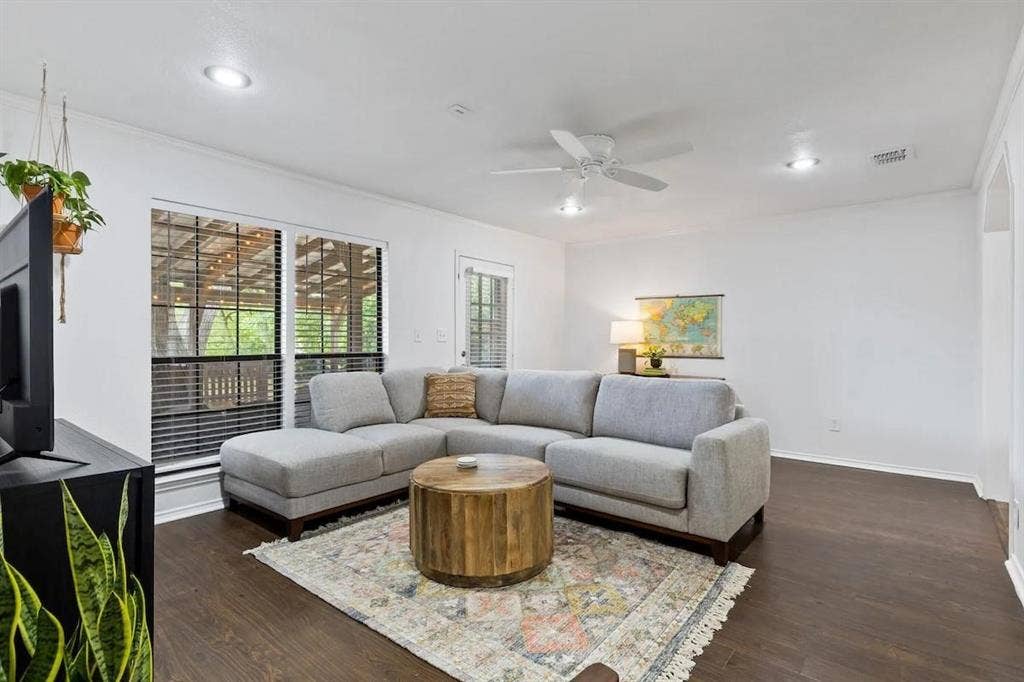 1101 N Waddill Street, McKinney, TX 75069 Interior featuring dark wood-finish flooring, recessed lighting, white ceiling fan, and large windows with horizontal blinds