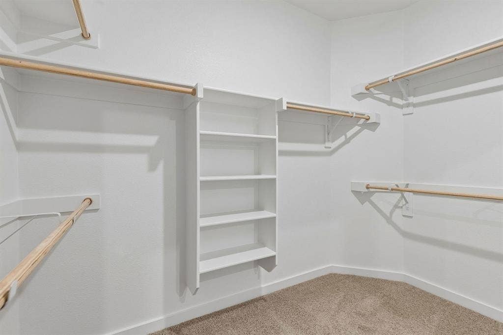 6004 Broadacre Drive, McKinney, TX 75071 Primary Closet in the Emmy II home plan - REPRESENTATIVE PHOTO
