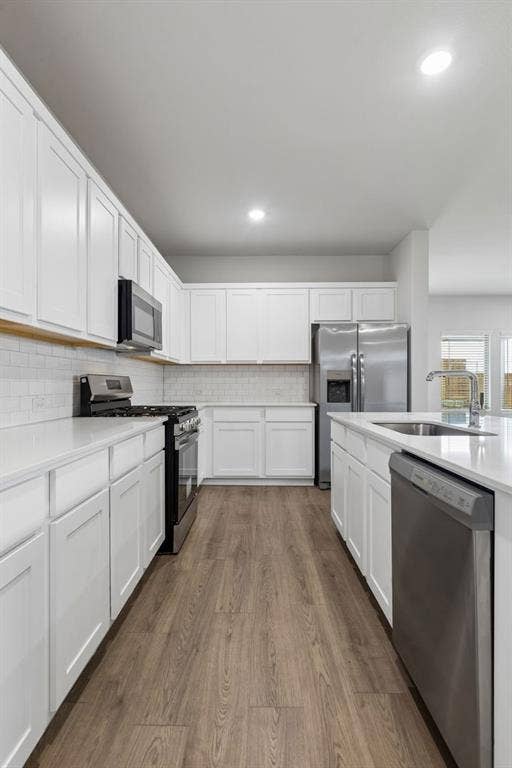 703 Edgehurst Drive, McKinney, TX 75071 Kitchen in the Oscar home plan – REPRESENTATIVE PHOTO