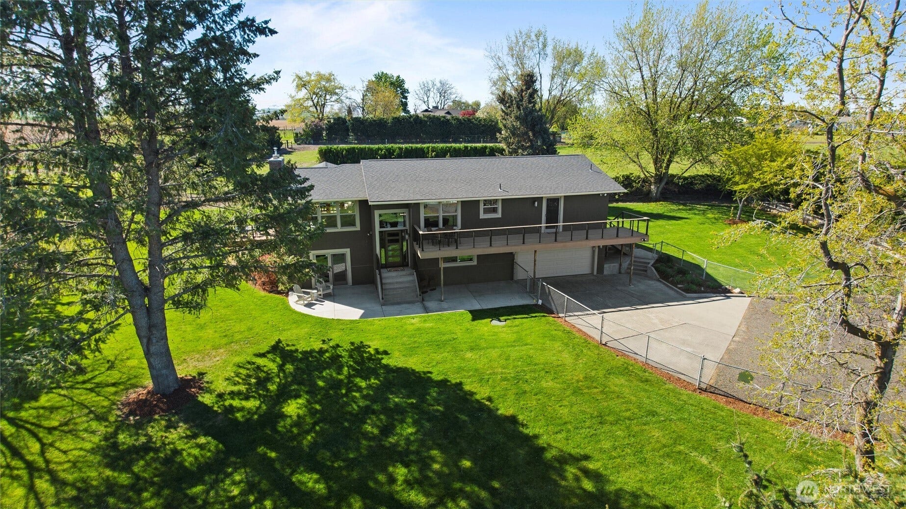 The park-like grounds are tidily landscaped and feature beautiful shade trees and a smart sprinkler system.