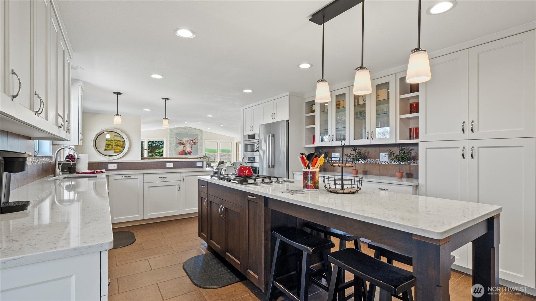 The large center kitchen island provides eat-in dining and yes, more additional seating for the big meal!