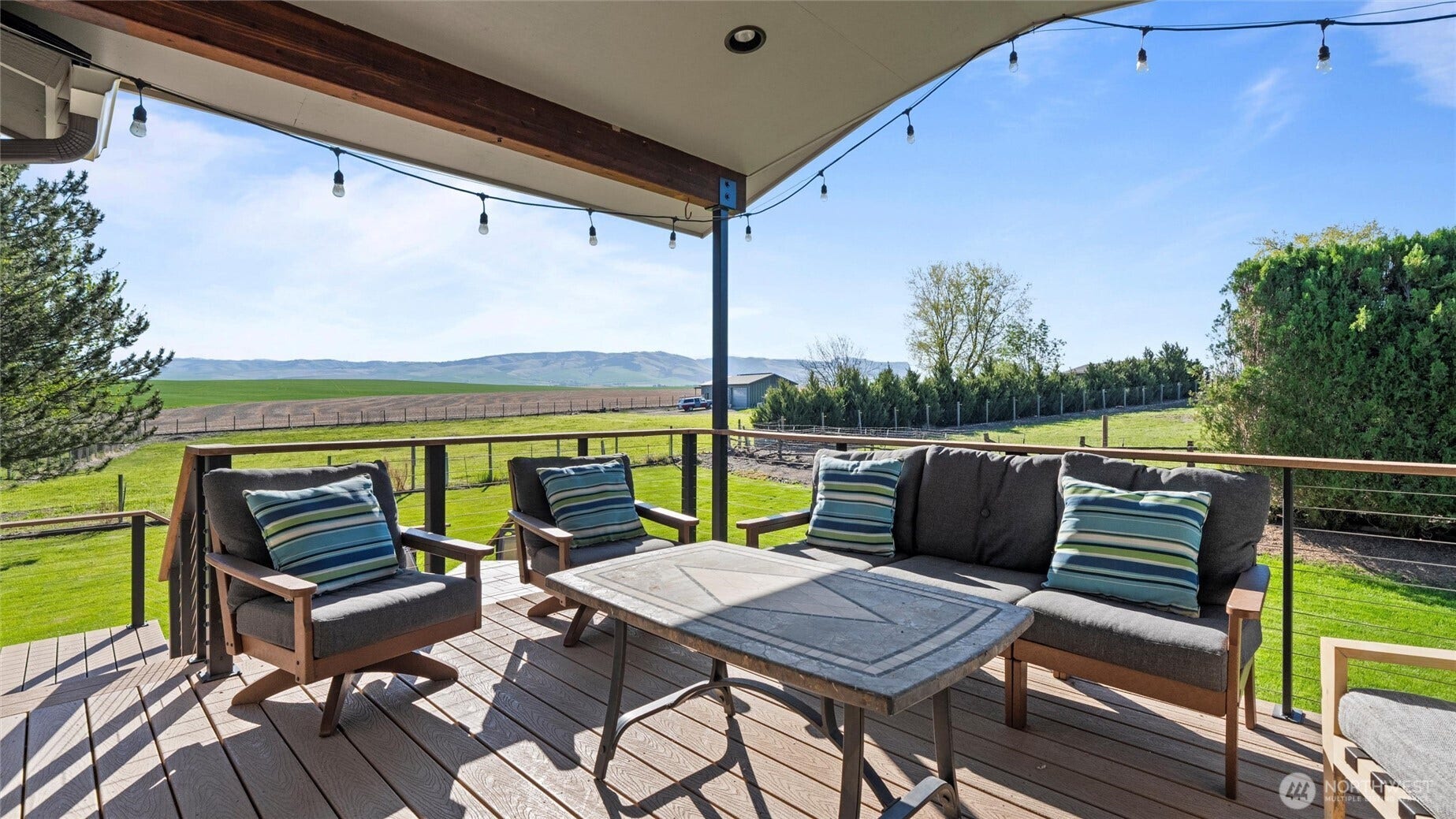 The upper deck is covered with built in lighting and roller shades. This photo simply does not do justice the views. See them in person - you'll never want to leave.