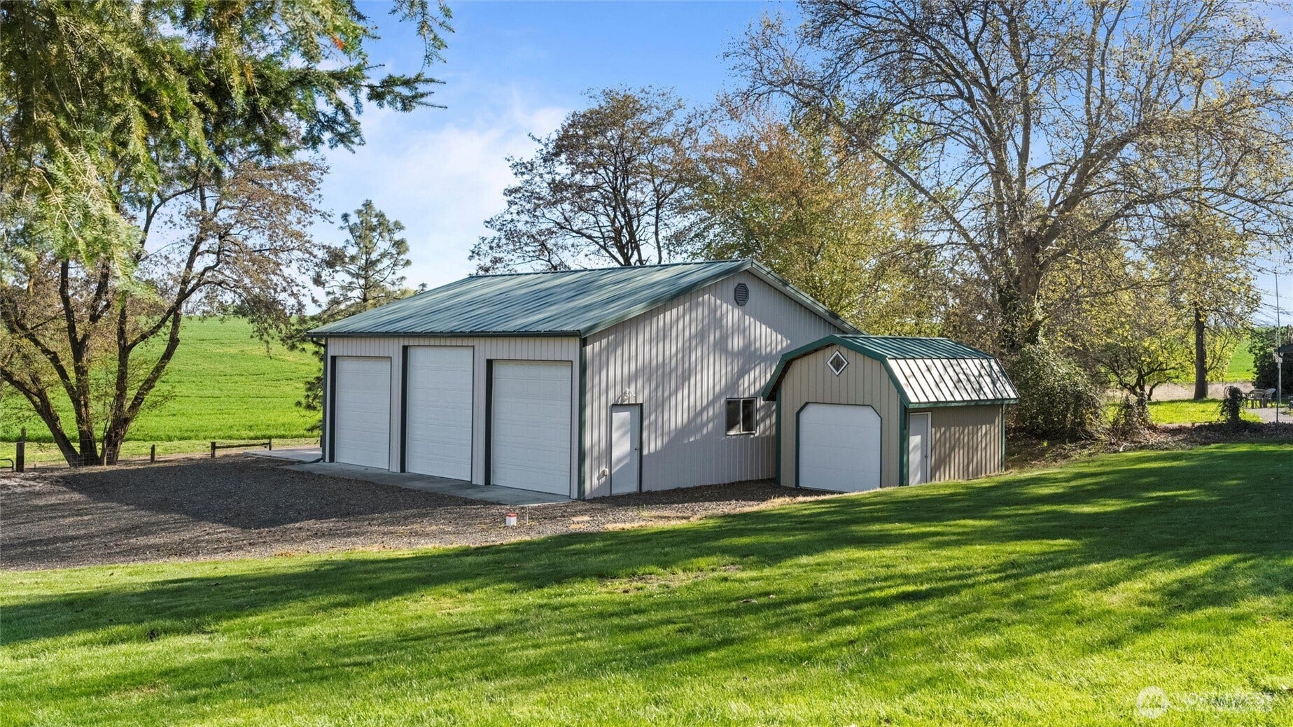Got toys? Need storage? Future guest house or studio? The 1300 s.f. shop features oversized commercial doors and 220 power. There is also a large RV pad on the north side of the building! Garden shed has a concrete floor as well.