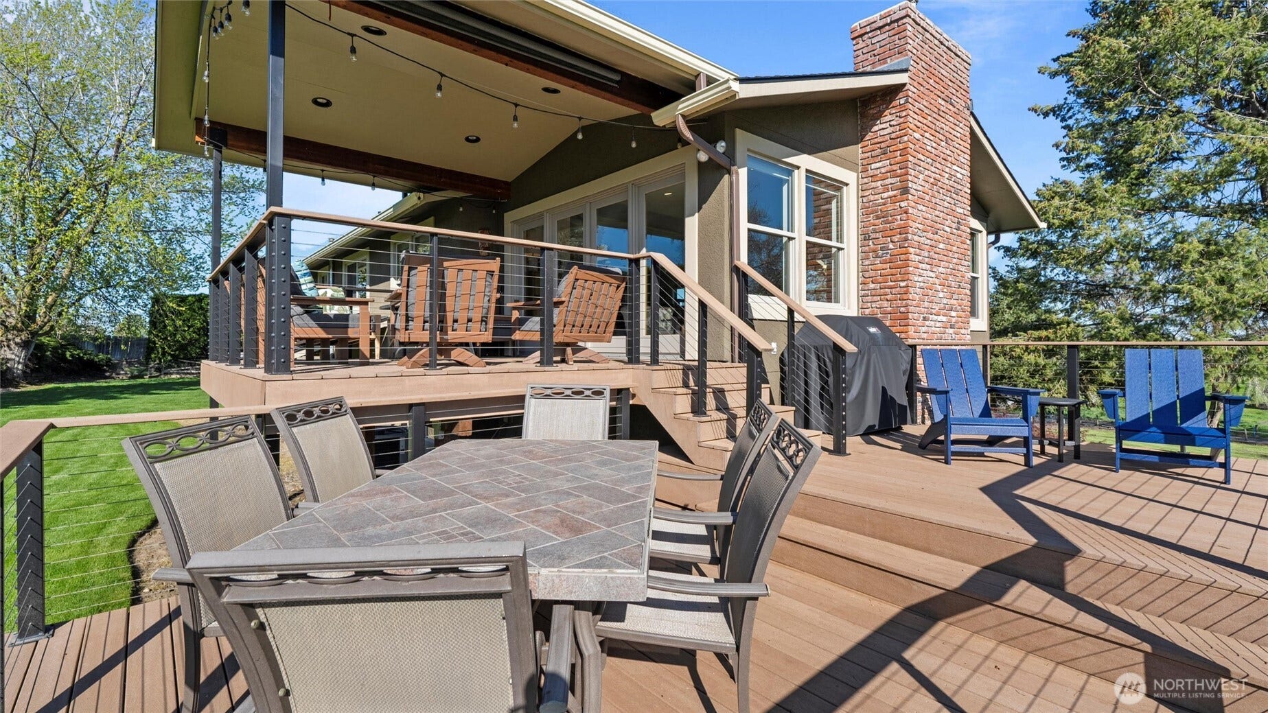 The tri-level deck invites you to lounge and play in the sunshine. The "middle" deck is plumbed for a grill or gas fire pit.