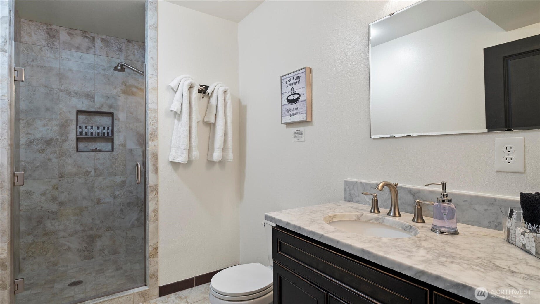3/4 lower floor bathroom with large, step-in shower.