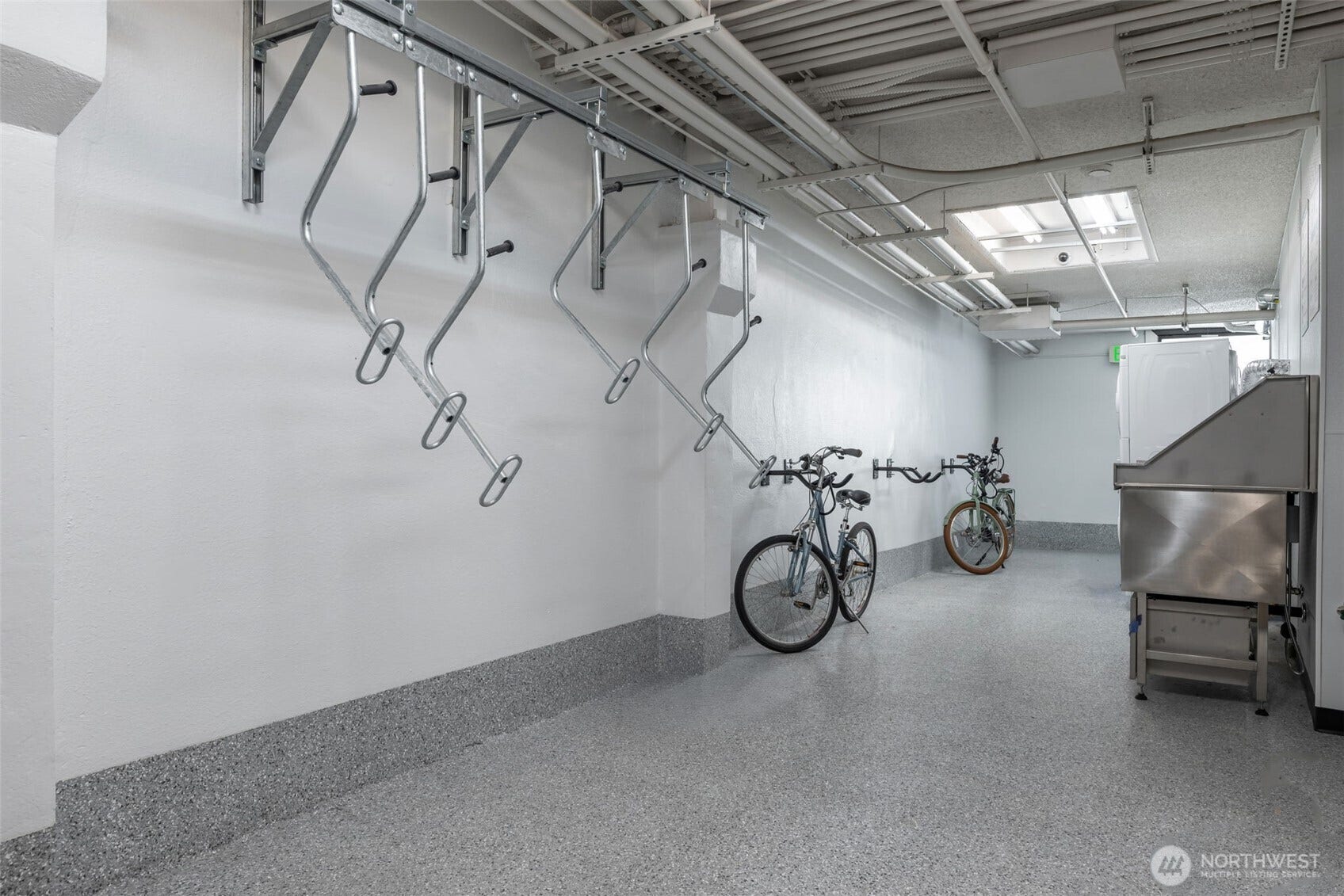 403 Terry Avenue, #206, Seattle, WA 98104 Bike storage in Laundry room. Newly added dog washing station on right.