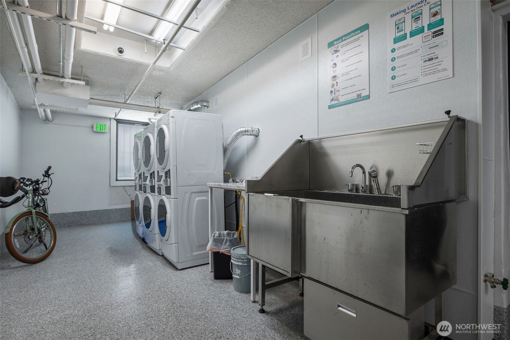 403 Terry Avenue, #206, Seattle, WA 98104 Terry Terrace has a newly remodeled laundry (in addition to many units having their own WD), with bike storage and newly added dog washing station. E-bike charging and storing also available in secured room off of laundry.