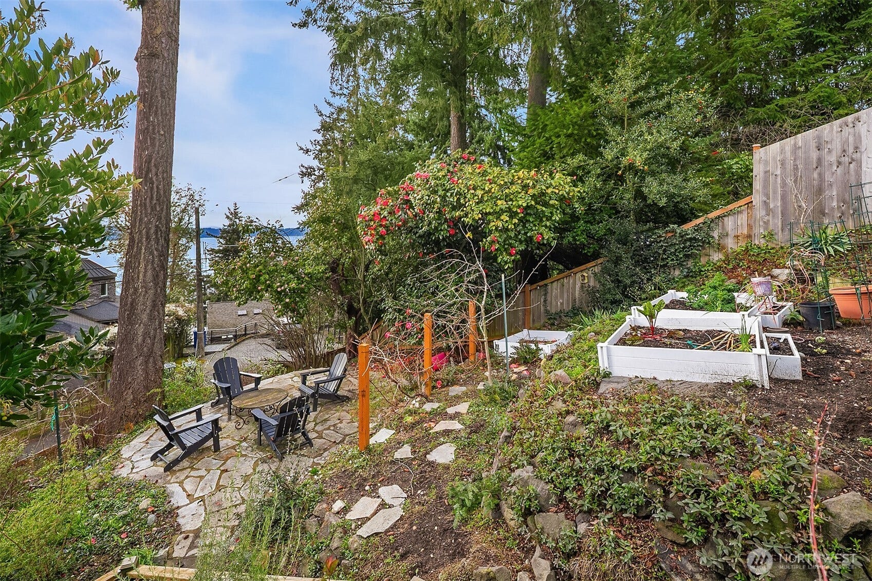 Lower level patio is perfectly situated to gather and immerse in the surrounding nature.