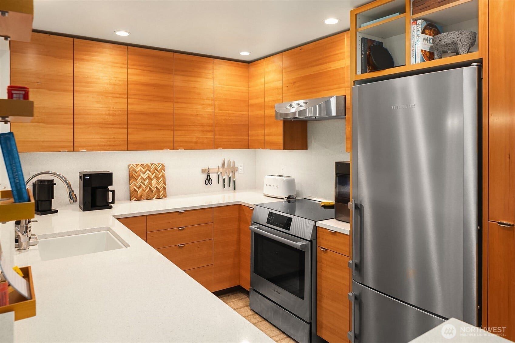 15628 8th Avenue SW, #B, Burien, WA 98166 These gorgeous bookmatched hemlock cabinets are a showstopper. (Bookmatched cabinets feature mirror-image grain or pattern across adjoining cabinet doors or drawer fronts, resembling the pages of an opened book.)