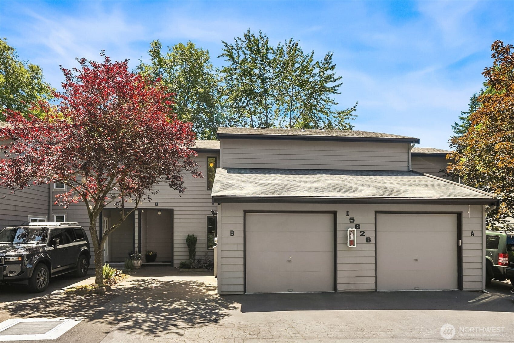 15628 8th Avenue SW, #B, Burien, WA 98166 Situated in the rear-most building, Unit B has an attached one car garage and a dedicated parking space steps from the front door. (Guest parking is available nearby.) New roof May 2026.